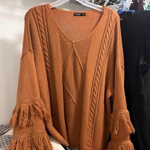 Rust colored sweater with flare fringe sleeves
